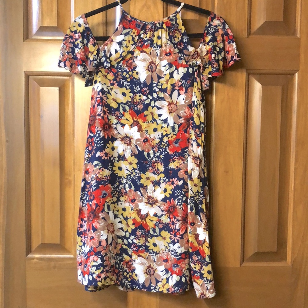 Summer Navy flowered dress with warm palette of flowers.